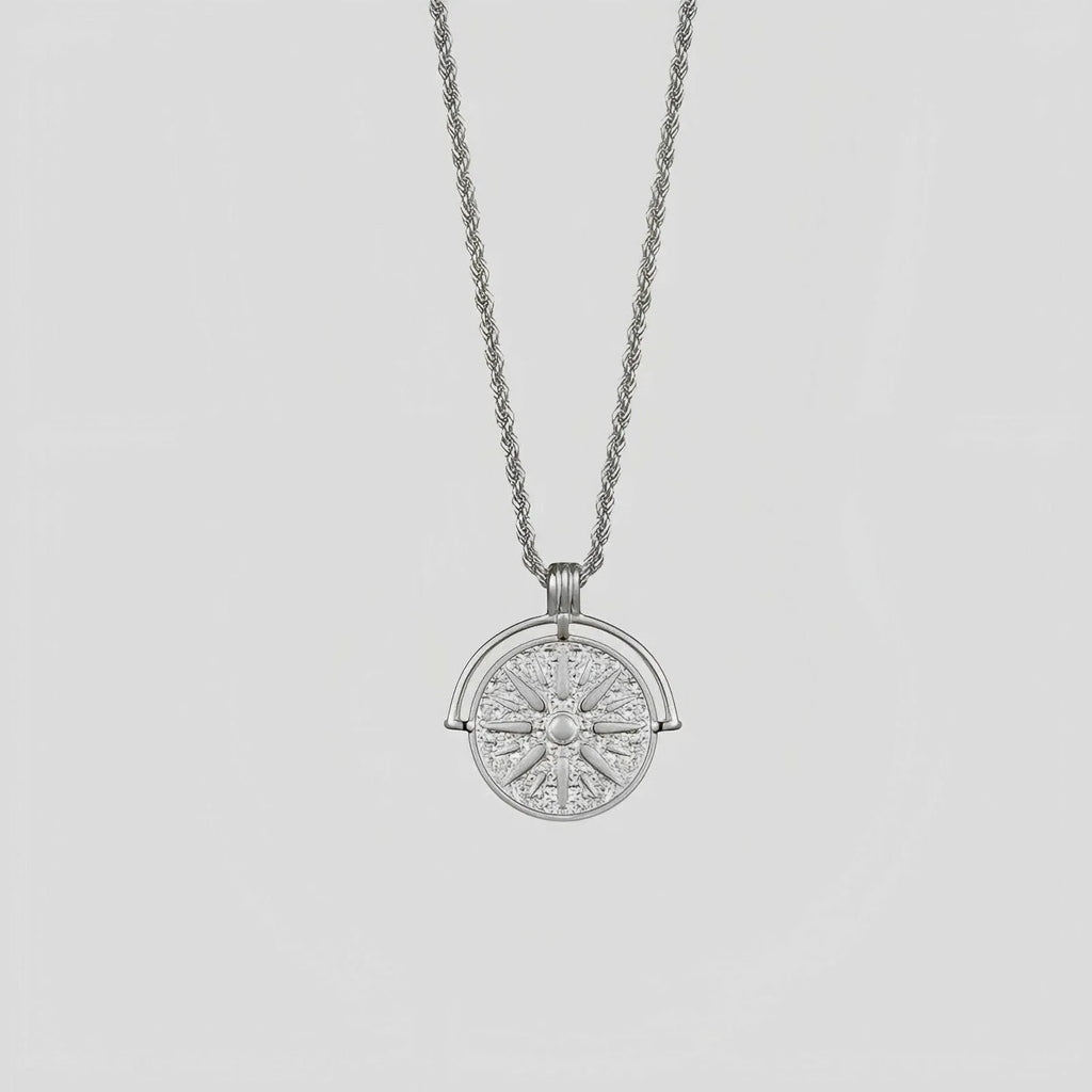 Stainless steel necklace with round embossed sunflower pendant featuring six-pointed stars on adjustable chain