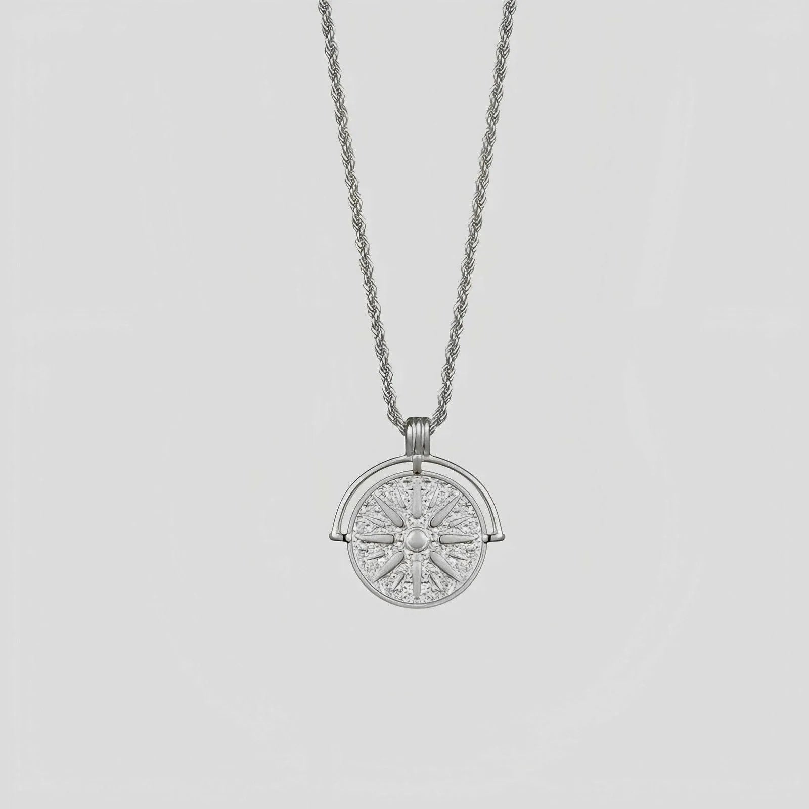 Stainless steel necklace with round embossed sunflower pendant featuring six-pointed stars on adjustable chain