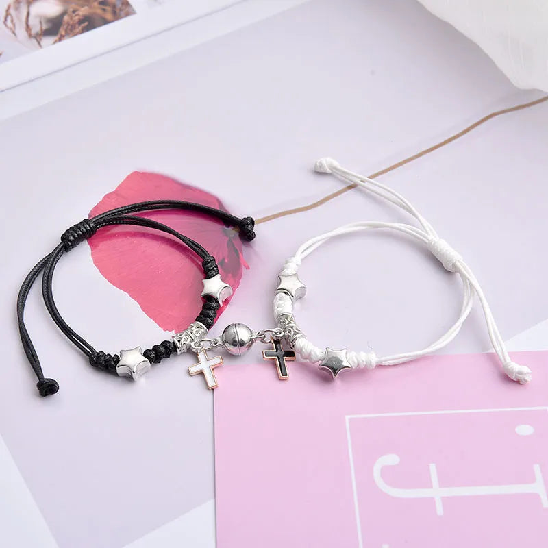Pair of alloy suction bracelets with engraved symbol choices including crown, love lock, and clover.