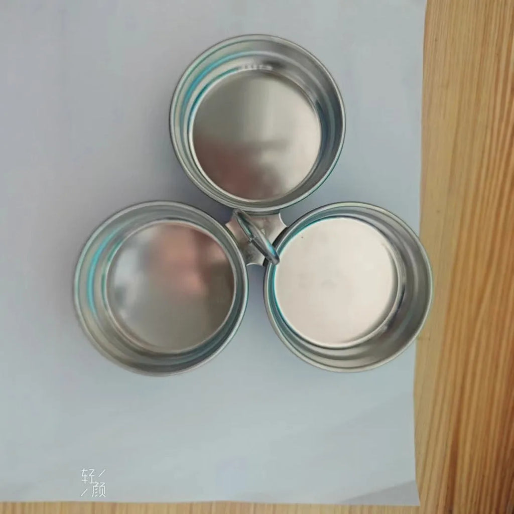 Stainless steel mini egg steamer in heart-shaped and round designs for boiling and stewing eggs.