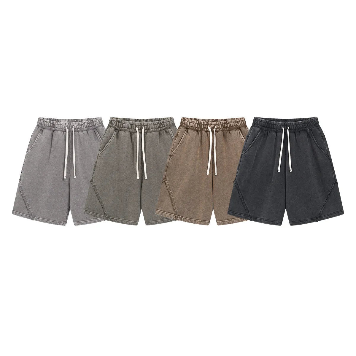 Men's loose black batik washed cotton shorts with patch craft design on a neutral background.