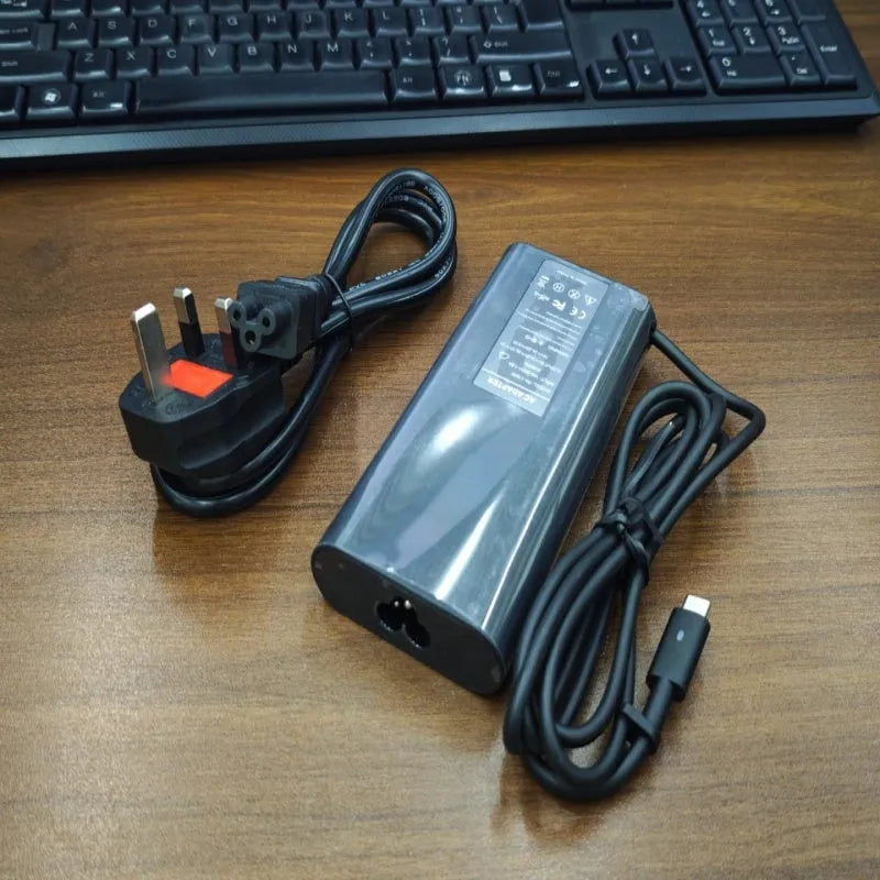 Black 65W USB Type-C laptop power adapter with international power cords
