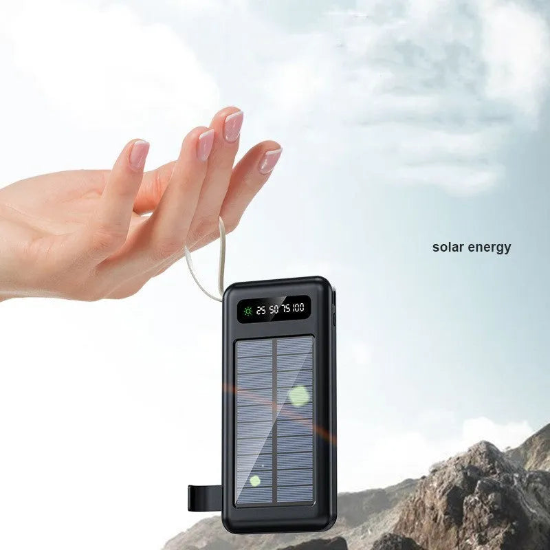 Black and white solar power bank showing its built-in solar panel and USB port.