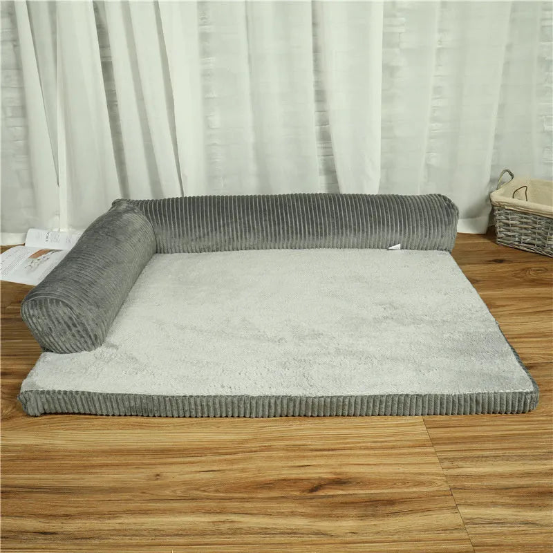 Corduroy fabric dog bed with bolster sides in a choice of coffee, grey, or red colours on a non-slip base.