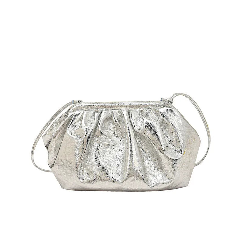 Simple hair clip fastening crossbody bag in shell shape, shown in rose red colour.