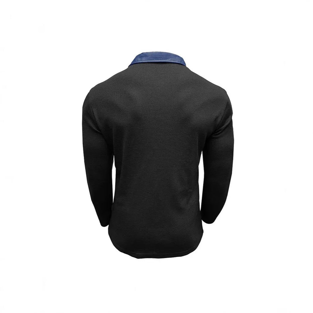 Man modelling a loose-fit long-sleeved waffle-knit polo shirt in a solid colour with an asymmetrical style detail.