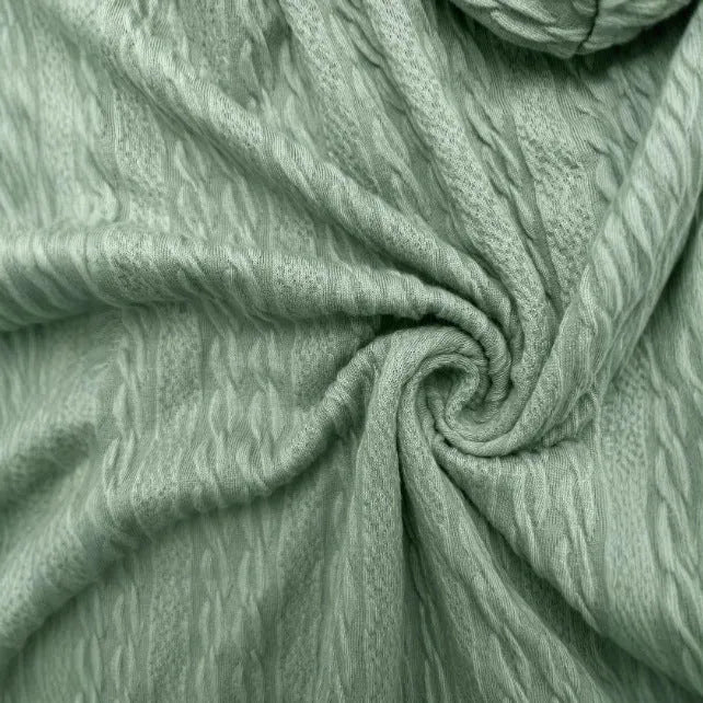 Green women's loose-fit hooded zip-up jacket on a hanger