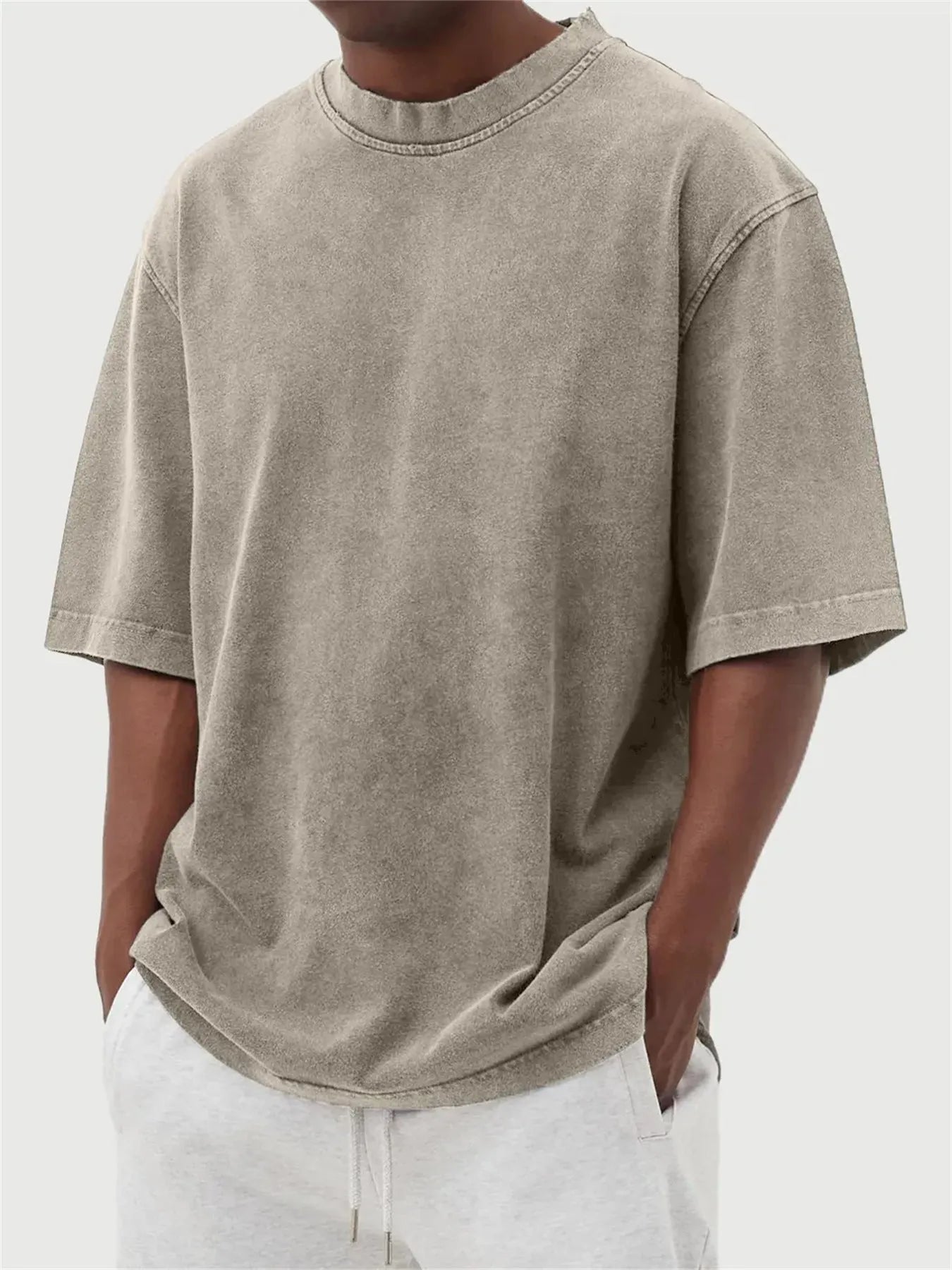 Men's loose fit distressed pullover t-shirt in stone washed polyester showing half sleeve design