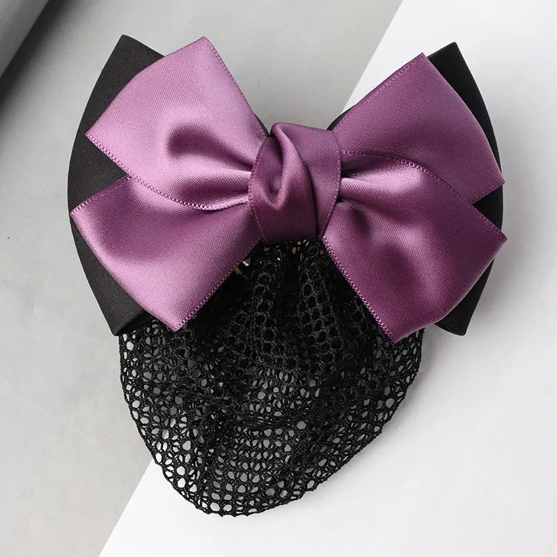 Professional flower bow headdress hair clip ornament on a work plate, shown in a selection of net and mesh colour variations.