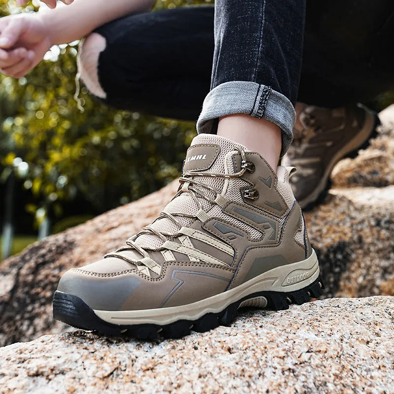A pair of low-top hiking sneakers with a lace-up front, shown in a colour option like grey or purple.