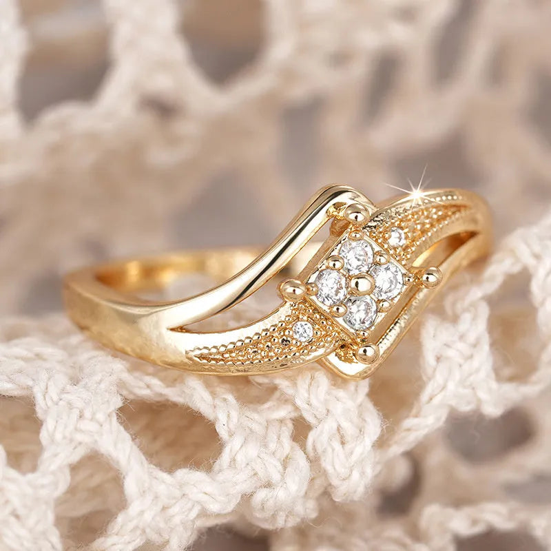 Women's yellow gold colour copper ring with diamond shape and micro inlaid zircon geometric design.