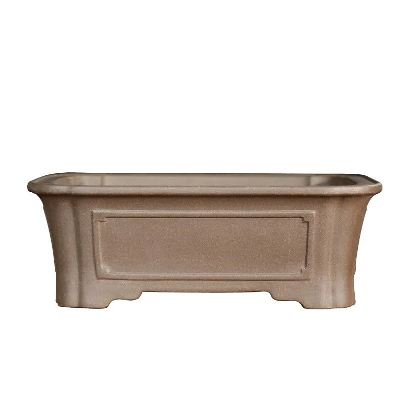 Antique-style rectangular purple sand planter with cut corners on a floor.