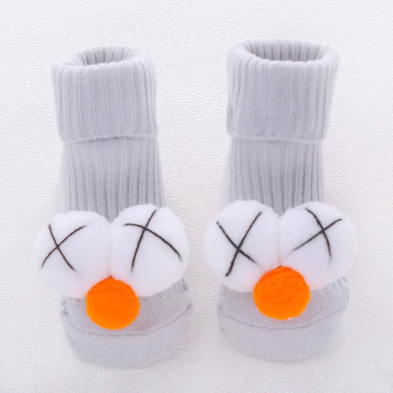 Cotton baby floor socks in various patterns including animal prints, stars, and bows for infants aged 0-3 months