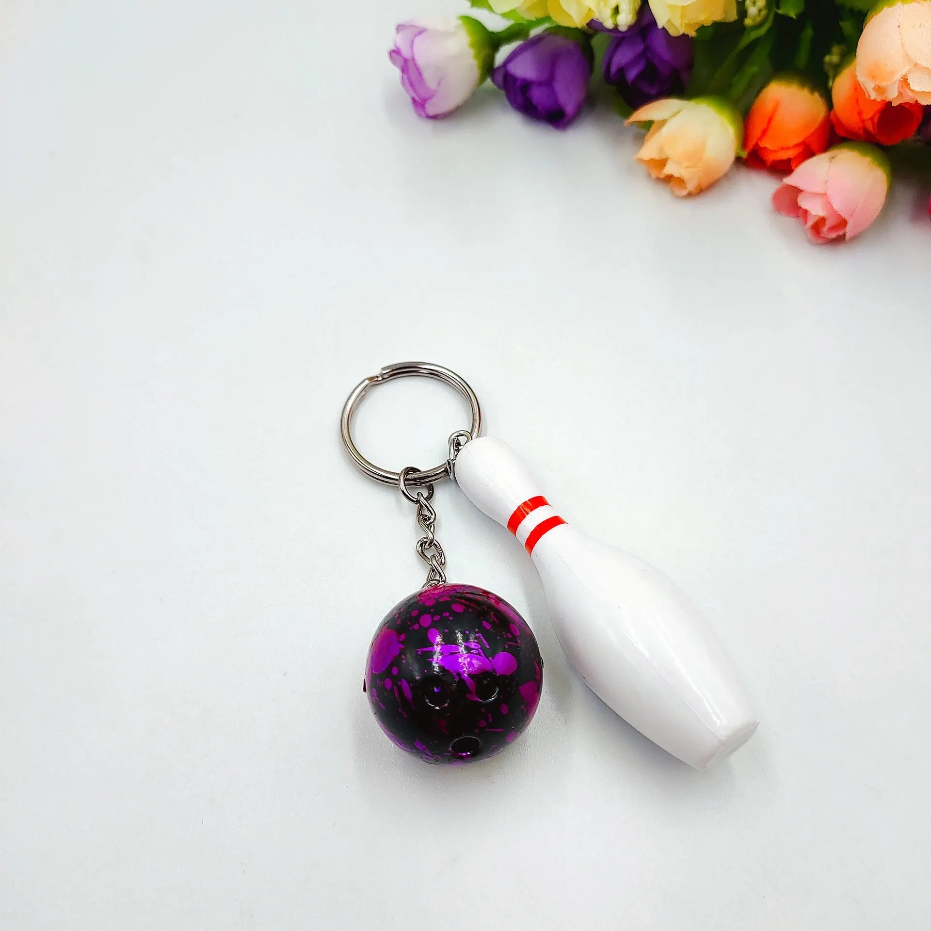 Mini bowling ball keychain pendant in blue colour with metal ring