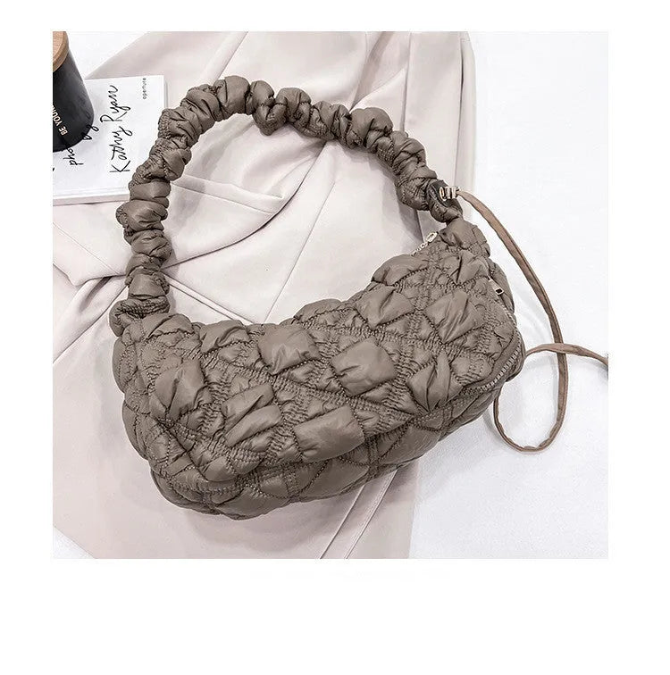 Women's casual nylon messenger bag in beige colour, showing front view with shoulder strap.