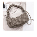 Women's casual nylon messenger bag in beige colour, showing front view with shoulder strap.