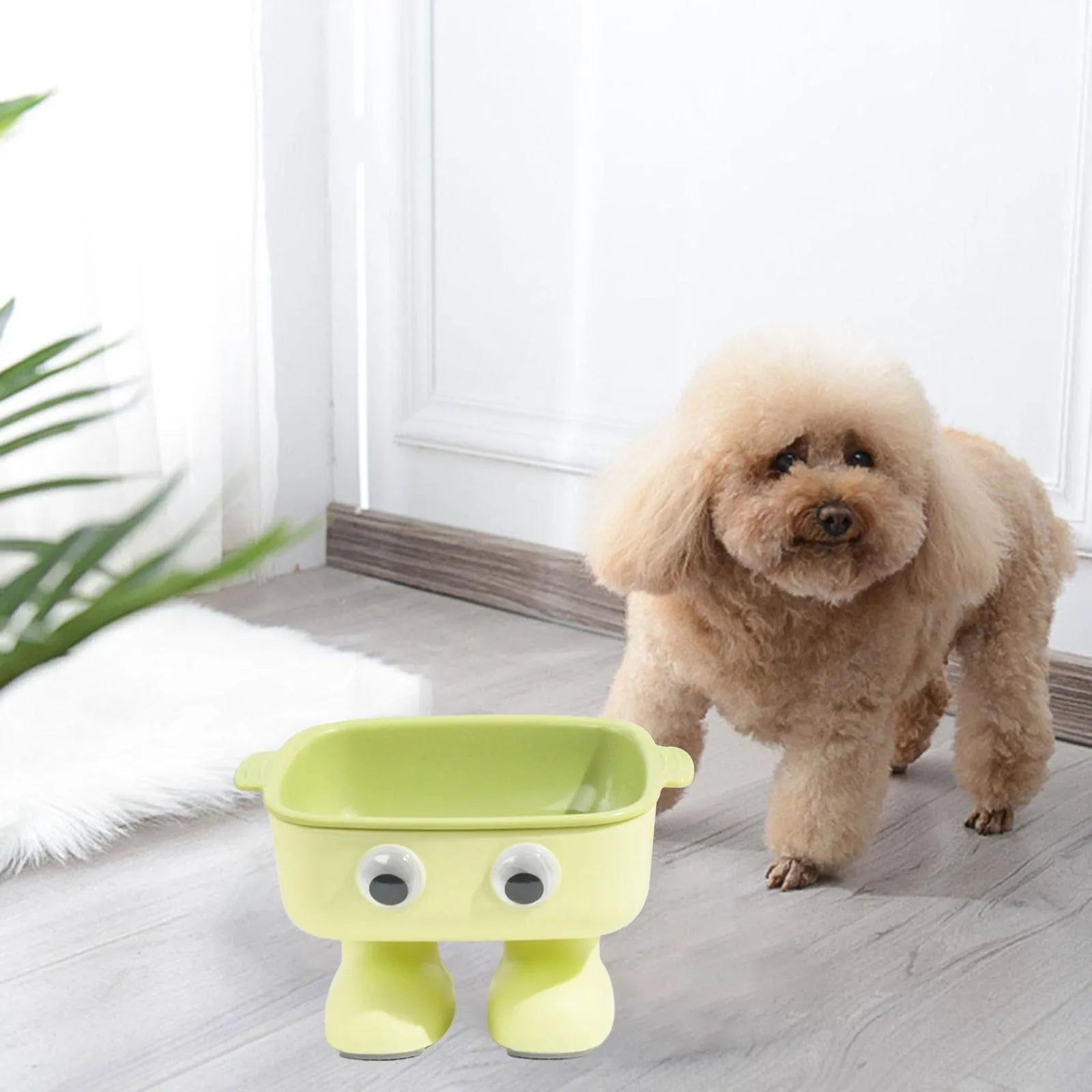 Elevated robot-shaped cat bowl with tilted design and detachable inner bowl in green colour