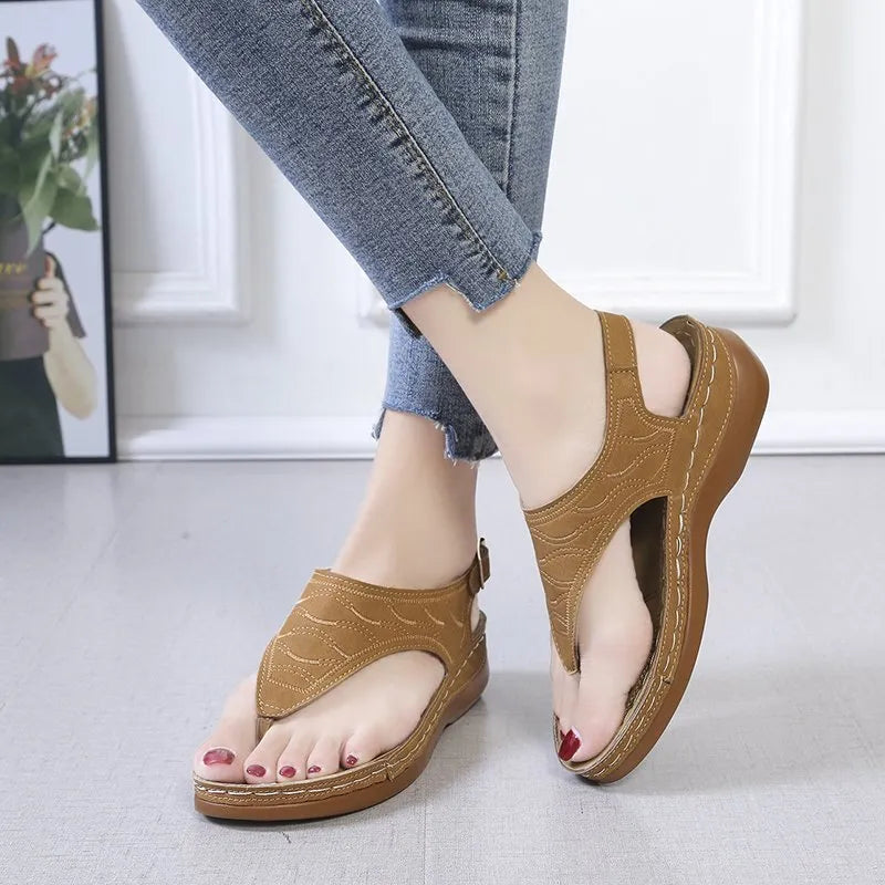 Women's casual wedge heel flip flop sandals with an adjustable back strap in solid colours.