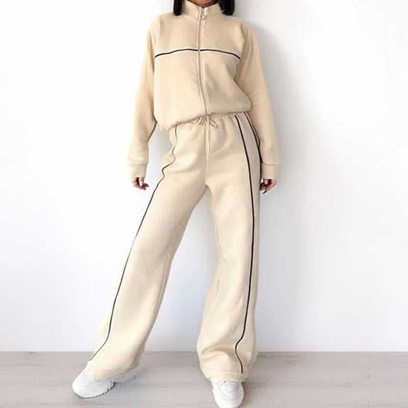 Casual polyester suit set showing a mock neck zip hoodie and matching striped trousers with lace-up detail.