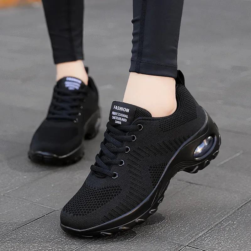 Red and black women's mesh sneakers with front lace-up and round toe on flat PU sole