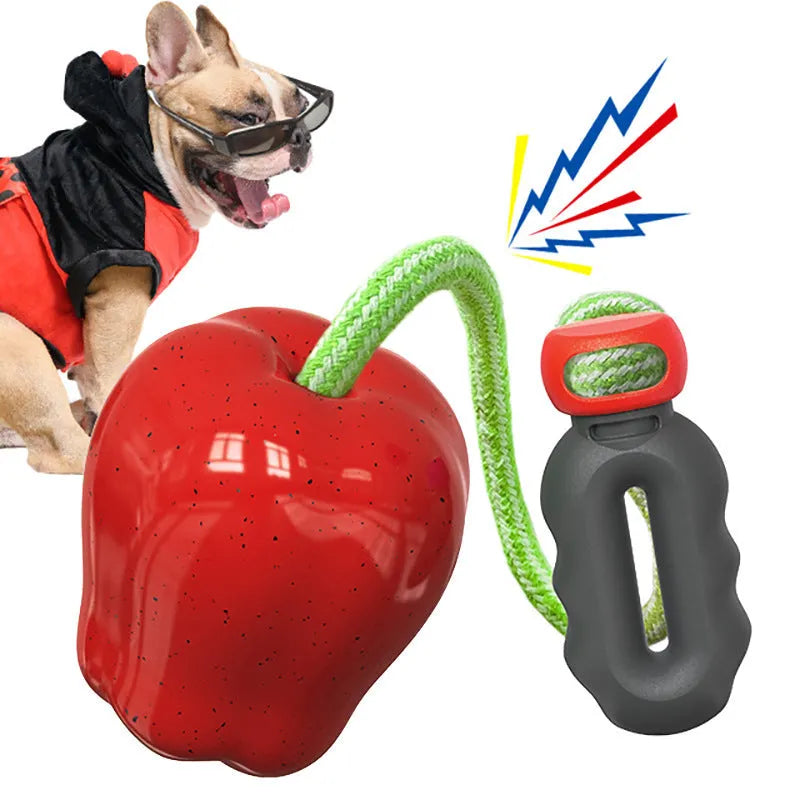 Green plastic apple-shaped dog toy with dropping ball for molar exercise