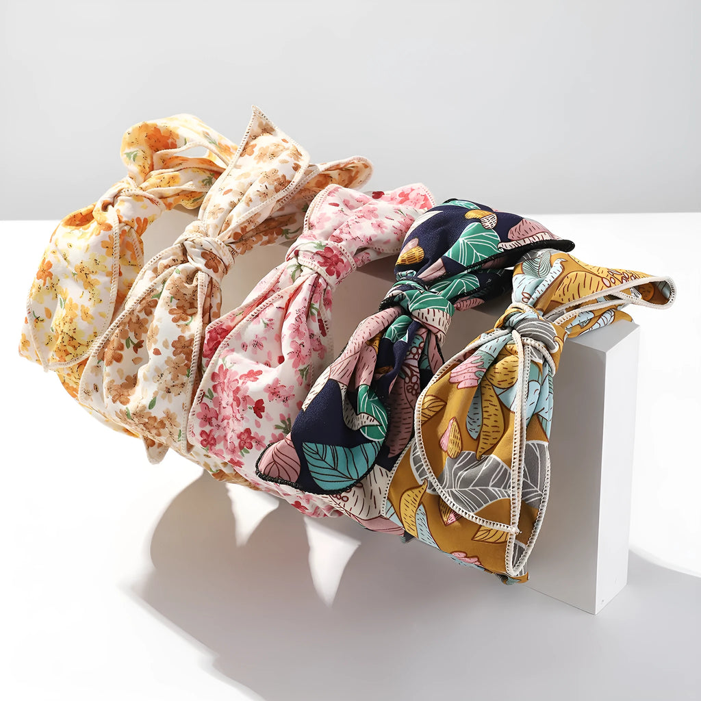 Handmade cloth hair bow with printed orchid and daisy flowers in pastoral style for women