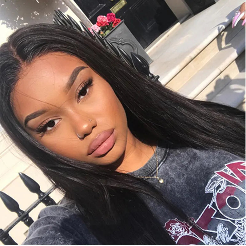 Long straight synthetic wig with centre-parted bangs in black colour on display