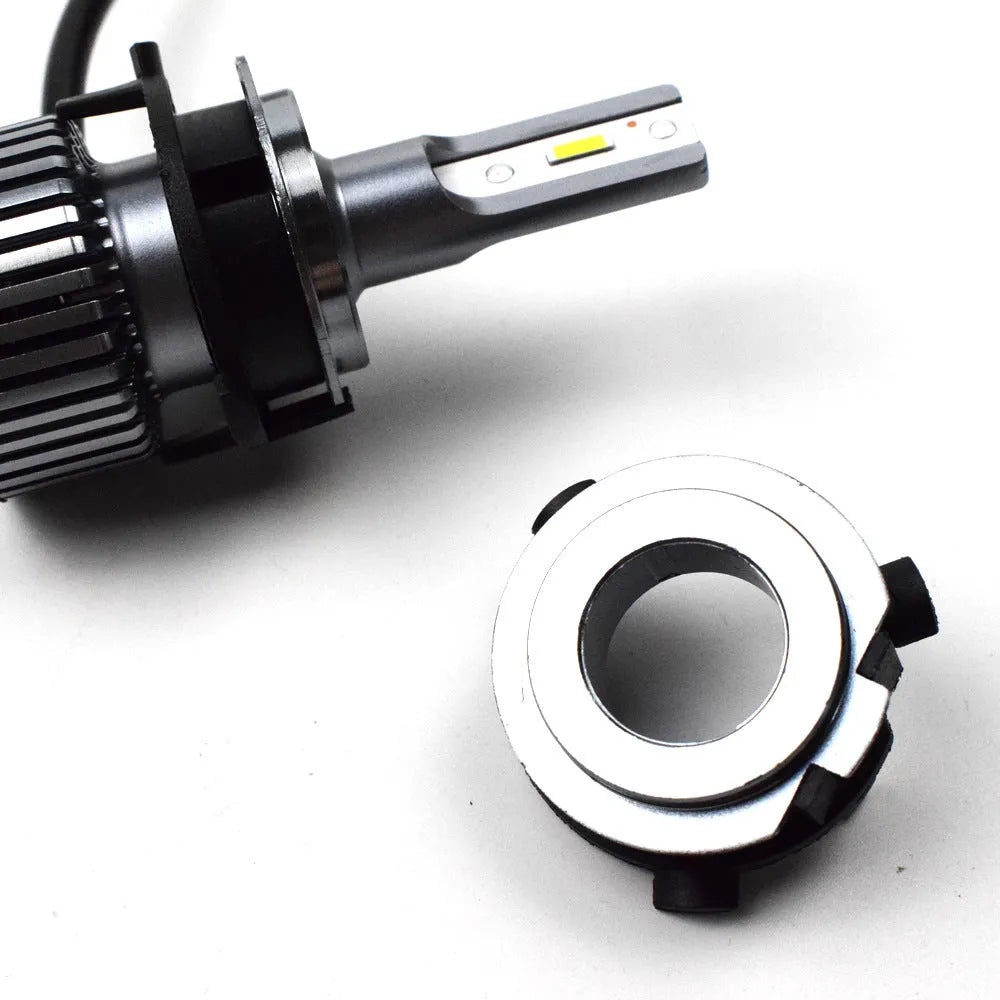 Black ABS plastic LED headlight shaped card holder for car dashboard.