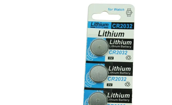 CR2032 3V lithium button battery showing front and side views with scale