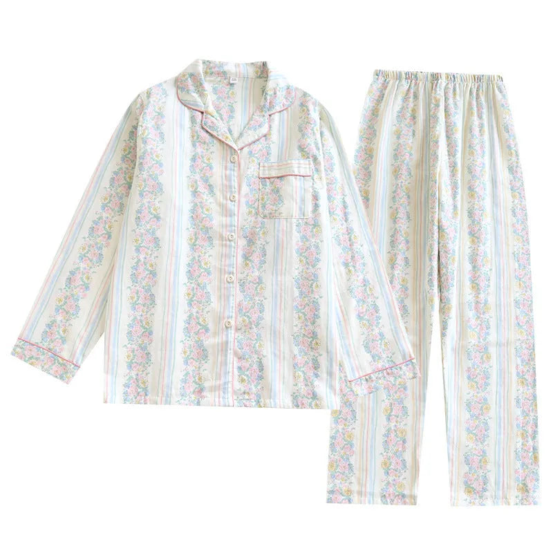 Ladies' red small fruit print cotton gauze long-sleeved top and matching trousers homewear set laid flat.