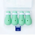 Four green silicone anti-scratch gloves designed to cover a cat's paws.