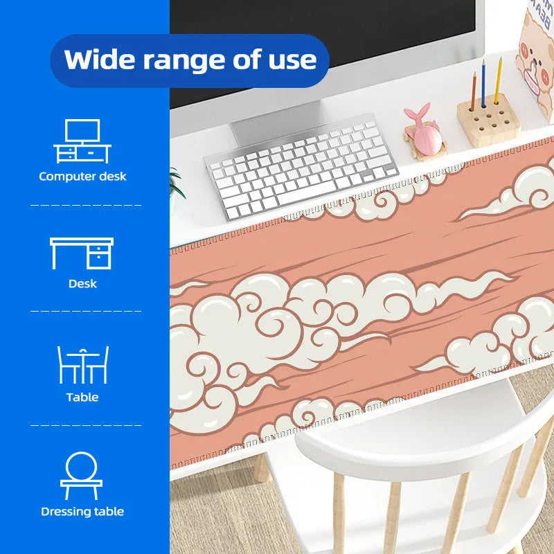 Large cloud pattern rubber desk mat with non-slip base on wooden desk surface