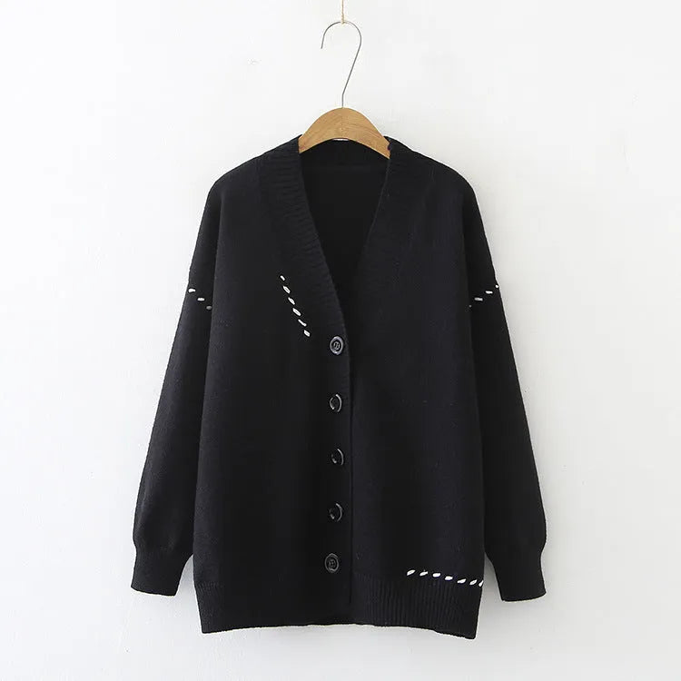Women's loose knitted cardigan coat in solid white or black colour with long sleeves