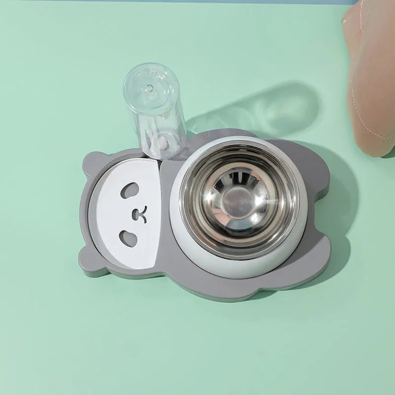 Grey panda-shaped pet feeder with tilted stainless steel bowls and automatic water bottle