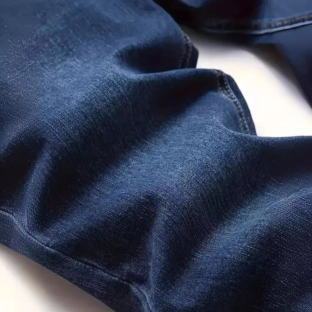 Men's slim fit dark blue jeans with skinny leg design and mid waist cut