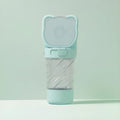 Green pink white portable pet water bottle with food container and waste bag dispenser