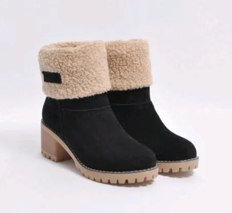 Women's black suede mid-tube knight snow boots with a thick sole and low flat heel on a plain background.