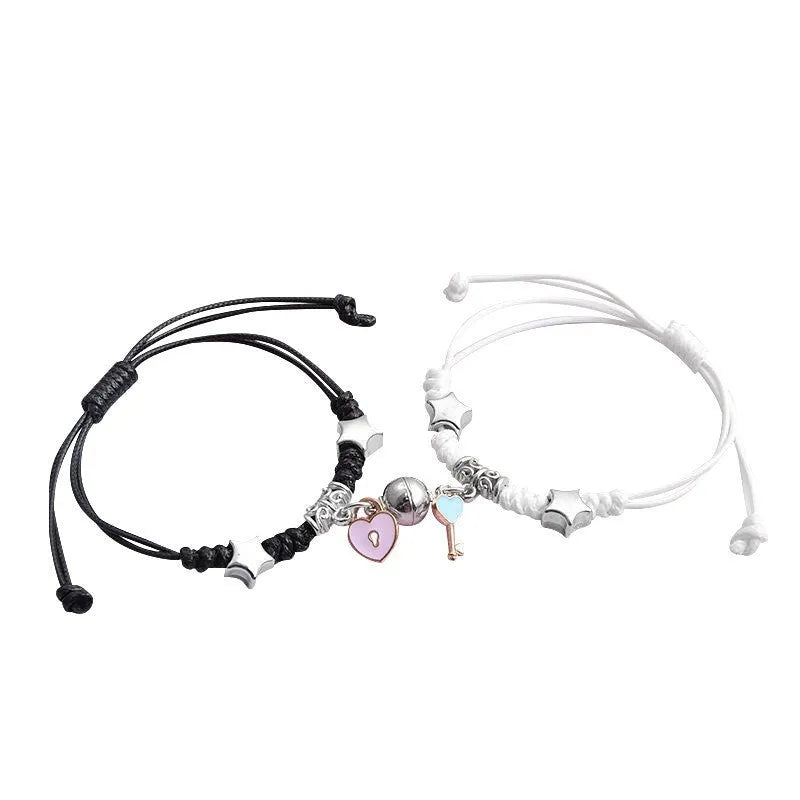 Pair of alloy suction bracelets with engraved symbol choices including crown, love lock, and clover.