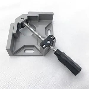 Black aluminium alloy 90 degree right angle clip with 70mm opening on a wooden workbench.
