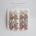 Children's fabric bow hairclips set showing dovetail design in multiple colour options