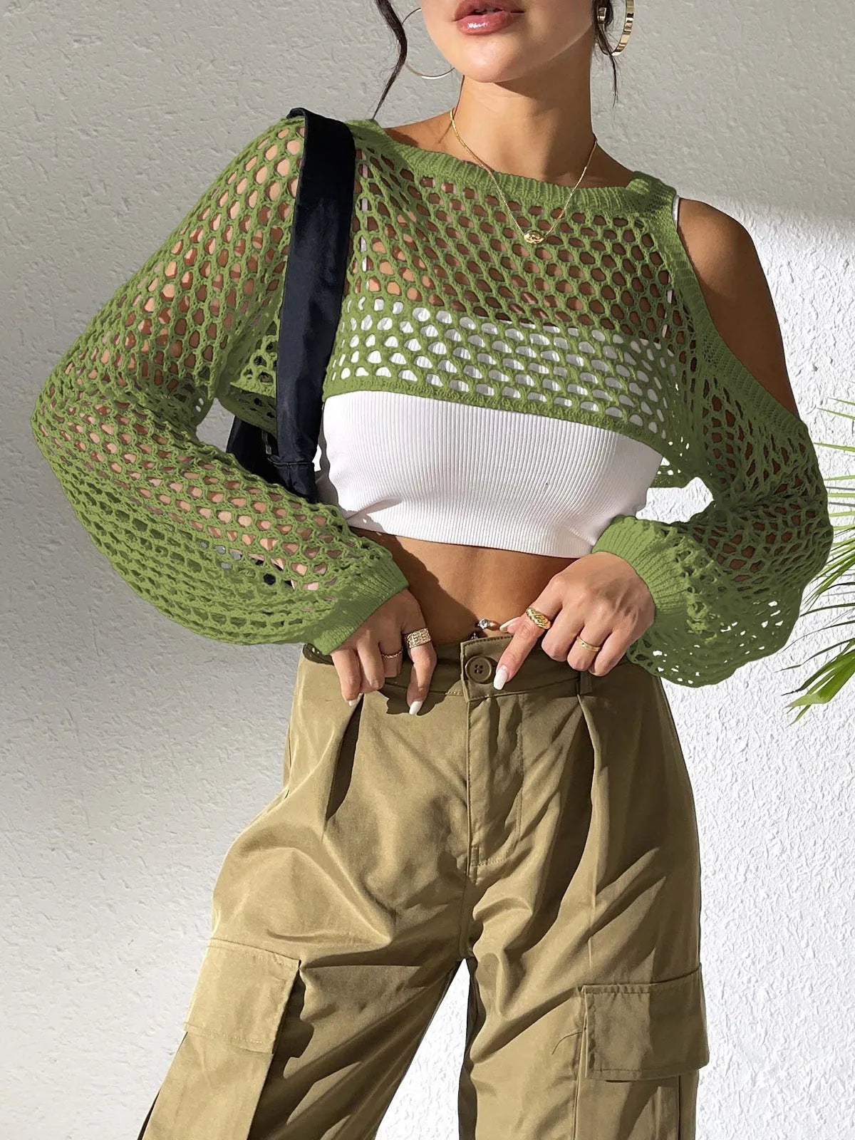 Mesh beach shirt with a hollowed navel section shown in multiple colour options.