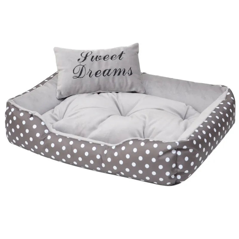Polka dot print dog bed with a matching square pillow in grey, blue, pink, or red.