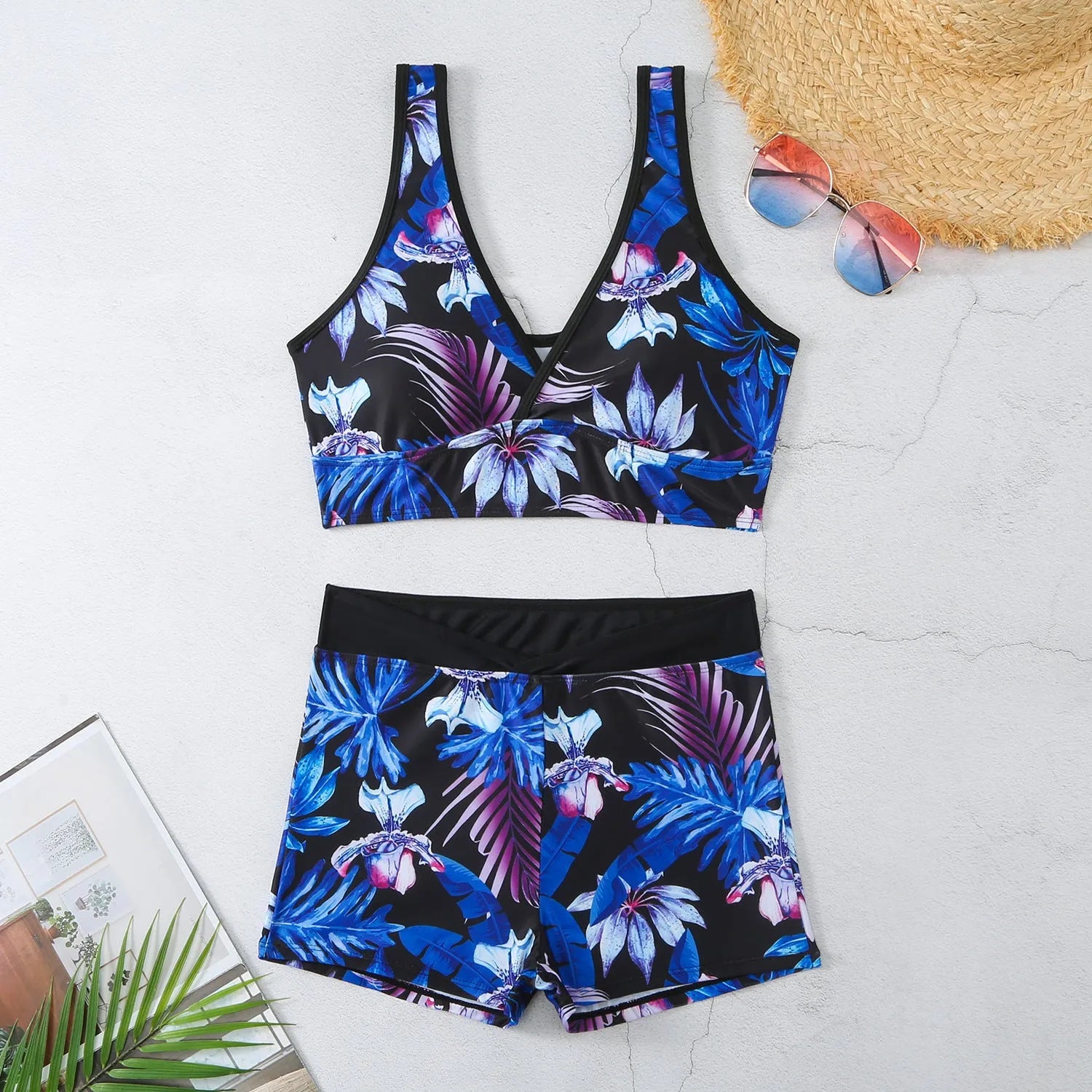 Women's two-piece sleeveless swimsuit with boxer shorts in a multi-colour print.