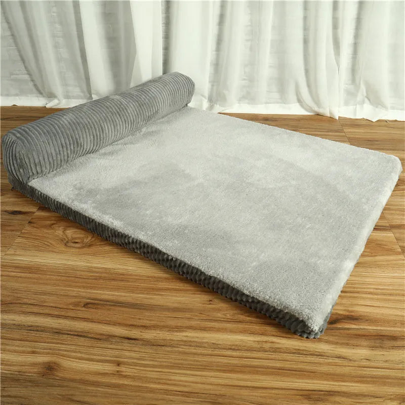 Corduroy fabric dog bed with bolster sides in a choice of coffee, grey, or red colours on a non-slip base.