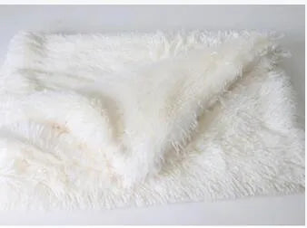 Long plush pet blanket in wool polyester blend showing dark grey, light grey and white colour options with size comparison