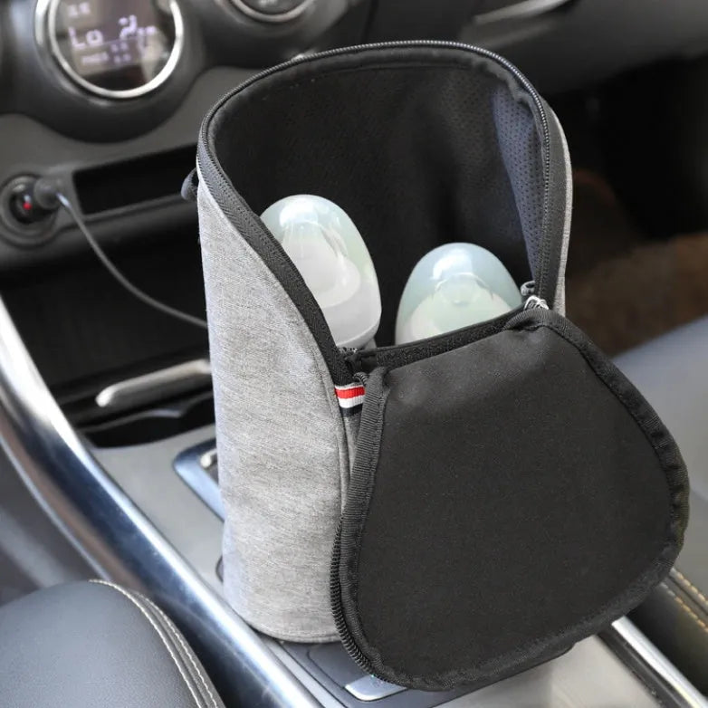 Grey Oxford cloth portable baby bottle warmer bag for car use with 12V charger and temperature display.