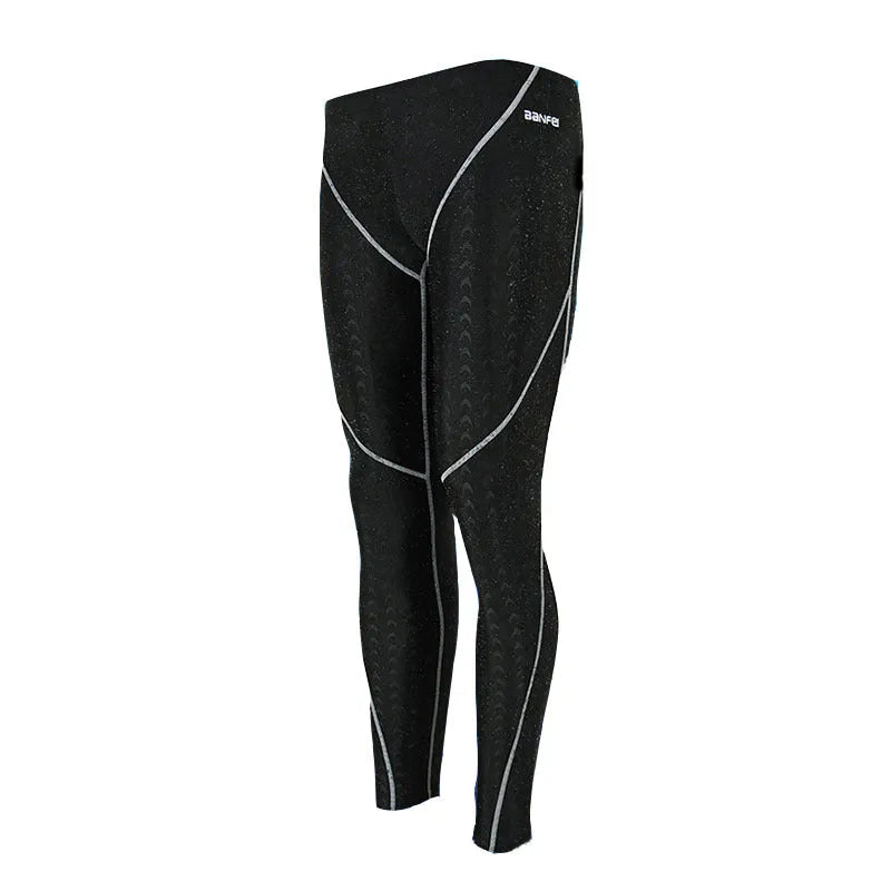 Men's black nylon cropped swimming trunks with a coloured line detail and brief style