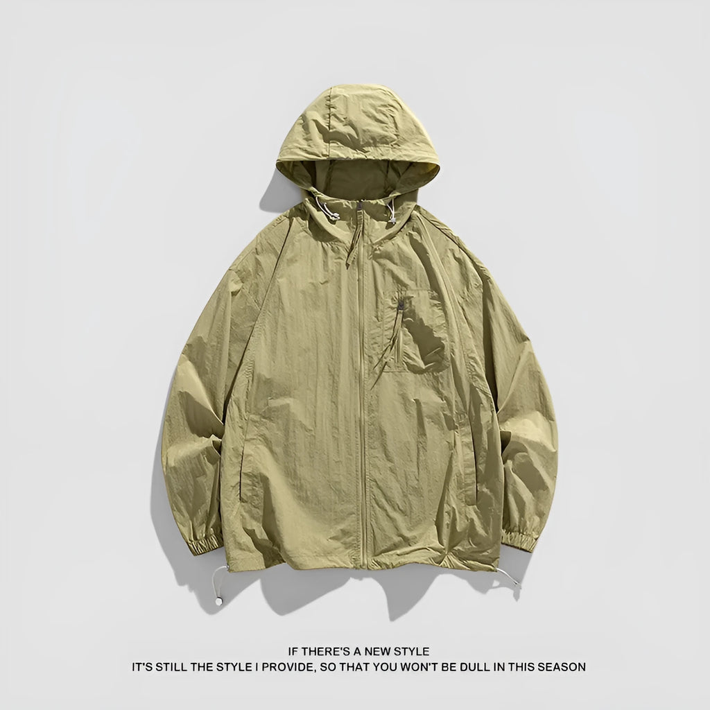 Lightweight Lycra hooded sun protection jacket in gray on a person standing outdoors