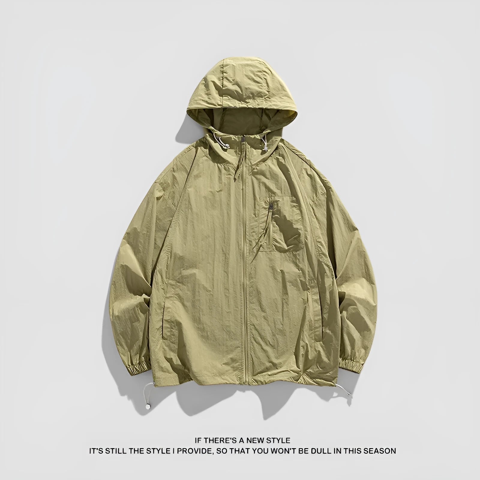 Lightweight Lycra hooded sun protection jacket in gray on a person standing outdoors