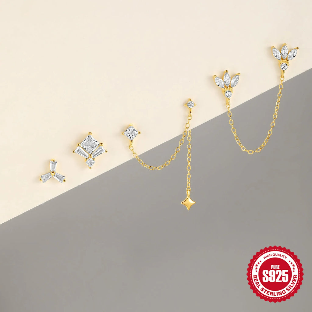 S925 sterling silver stud earrings with zircon inlay in golden geometric designs including clover and crown.